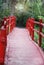 A look down the path of red, wooden bridge at Magnolia Plantation and Gardens.