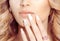 Look at my manicure. Beauty girl woman bride showing her hand new nails gel art style. Coral color lips makeup, diamond golden