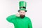 Look at my moustache. Bearded man celebrating saint patricks day. Hipster in leprechaun hat and costume twirling