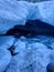 A look into one of the ice caves underneath a glacier at wedgemount lake