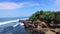 Look over the beach cliffs and choppy seas, on the coast of Bali, Indonesia. Environmental sustainability concept.