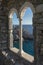 Look at Portovenere through a historic mullioned window