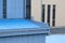 Look on the roof of blue and yellow factory foor with blue ladder in the middle. Looks like a swimming pool.