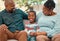 Look at that smile. a little boy spending time with his grandparents at home.