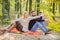 Look there. Relaxing in park together. Happy loving couple relaxing in park together. Couple in love tourists relaxing