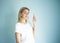 Look up gesture. Portrait of joyful woman with forefinger points up. Banner ad concept