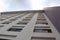 Look up at tall cement building hotel in thailand