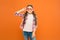 Look well and feel beautiful. Adorable girl with fashionable look on orange background. Little child having geeky look