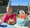 Look whos a year older today. Portrait of a happy little girl enjoying her birthday party outdoors.