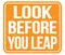 LOOK BEFORE YOU LEAP, text written on orange stamp sign