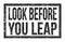 LOOK BEFORE YOU LEAP, words on black rectangle stamp sign