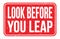 LOOK BEFORE YOU LEAP, words on red rectangle stamp sign