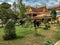 Looking across a grass covered area at Wat That Phoun Temple. 2