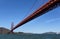 Looking along the Golden Gate Bridge from underneath- clear blue sky