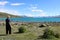 Looking along Lake Tekapo to snow capped peaks NZ