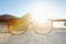 Looking at the bright side of life. POV shot of a person at the beach looking at the view through their sunglasses.