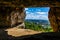 Looking down from above on the city from a cave