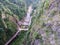 Looking down into a canyon with meandering road.