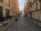 Looking down cobbled street in Pigalle neighborhood of Paris