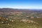 Looking down on green farm land from the Swartberg Pass