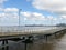 Looking down jetty to moored shipping