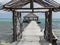 Looking down a long dock on the beach in san pedro