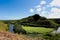 Looking down at the Maunakapu mountains and Wailua River in Kauai, Hawaii, USA, with a group of kayakers