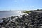 Looking down rocky shoreline