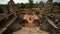 Looking Down Temple Steps as Tourists walk around the Altar - Angkor Wat, Cambodia