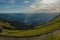 Looking down towards Kitzbuhel aki area and other mountains from the high Kitzbuheler horn on a sunny summer day