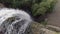 looking down at water cascading over a waterfall in slow motion