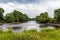 Looking downstream on the River Dee on a cloudy summers day in Galloway, Scotland