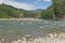 Looking Downstream on a Sunny Day at a Mountain River