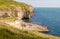 Looking East along the rocky Jurassic Coast from a cliff top coastal path with the Dancing Ledge, Langton Matravers, near Swanage,