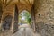 Looking through flint walled tunnel and arch