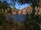 Looking Through Foliage at a Waterfall