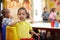 Looking forward to the future with positivity. Portrait of a cute ethnic boy posing for his picture at the table of a