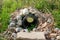 Looking Through a French Drain With a Black Pipe and Rocks Surrounded it