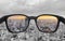 Looking through glasses to city view in sunset. Color blindness glasses, Smart glasses technology
