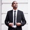 Looking good in a suit. a handsome young businessman looking dapper while standing outside in the city.