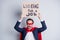 Looking for a job. Photo of stressed mature business guy homeless person career crash super hero costume carton placard