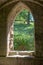 Looking through Norman ruined stone window to Countryside