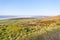 Looking out across the fields and valleys of the Derbyshire countryside on a cloudless winter morning.