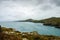 Looking out across the sea, cliffs and hills along the wild Pembrokeshire coast. With dark clouds on a September day. Wales.