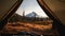 Looking out onto mountain view from inside camping tent