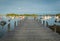 Looking out over the dock into the harbor with lobster boats and buoys