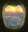 Looking out the plane windows. Beautiful scenic overhead airplane view of sunset colorful sky