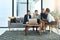 Looking over their latest work. a group of businesspeople talking together over a laptop during a meeting.