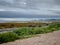 Looking over the to the Cowal Peninsula with incement weather over the beach south of Greenock, Scotland