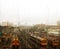 Looking through scratched window with raindrops at trains parked on tracks near Brisbane Australia